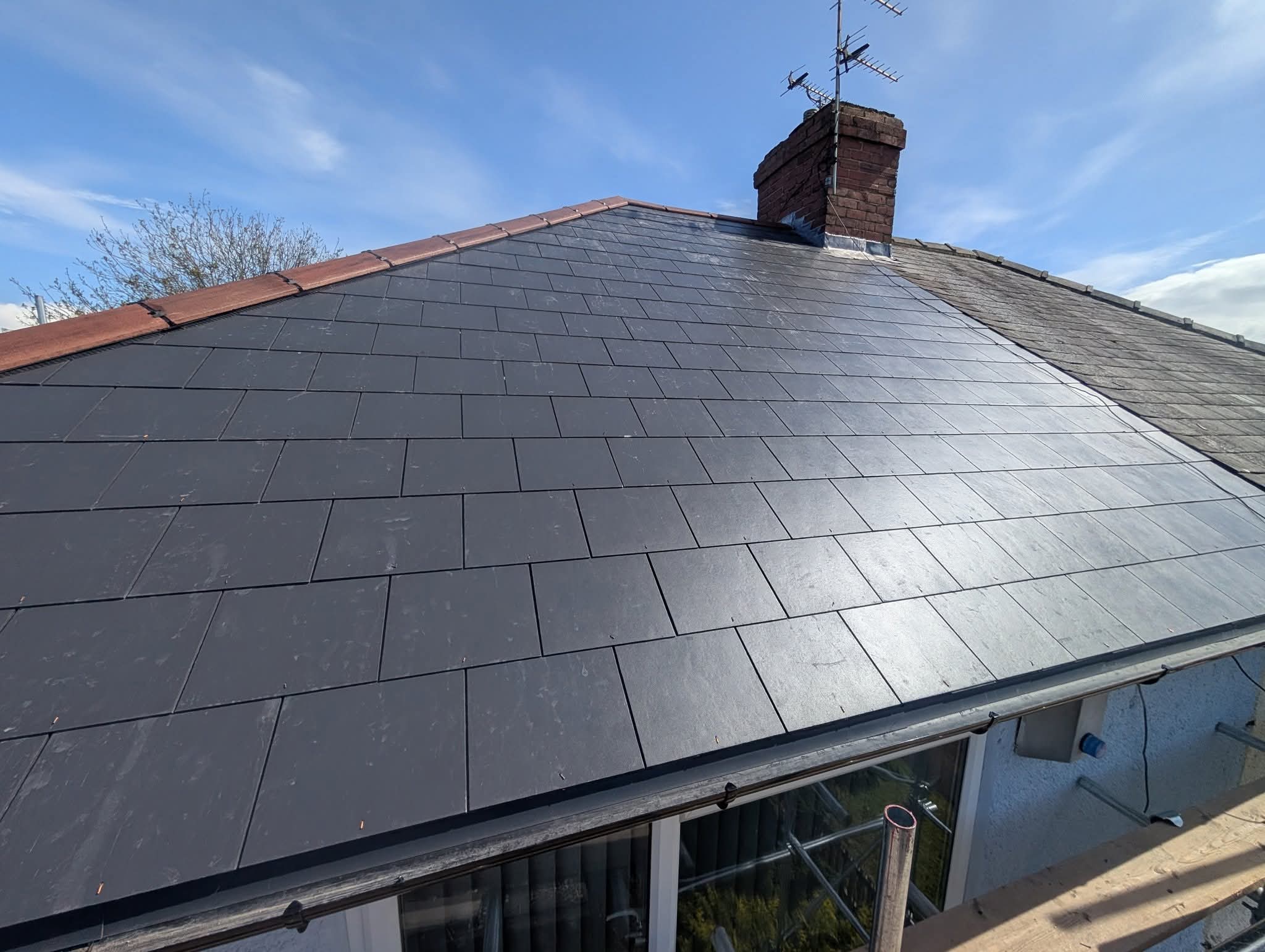 Finished slate re-roof with new ridge tiles and chimney leadwork